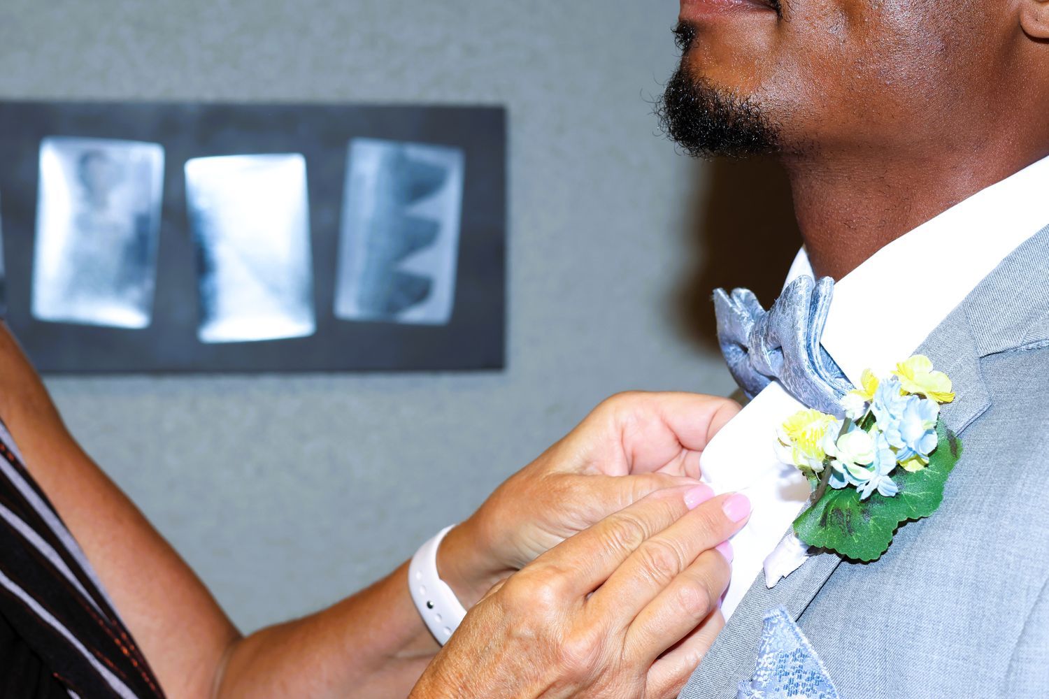 Wedding detail shot - rings, flowers, and decorative elements
